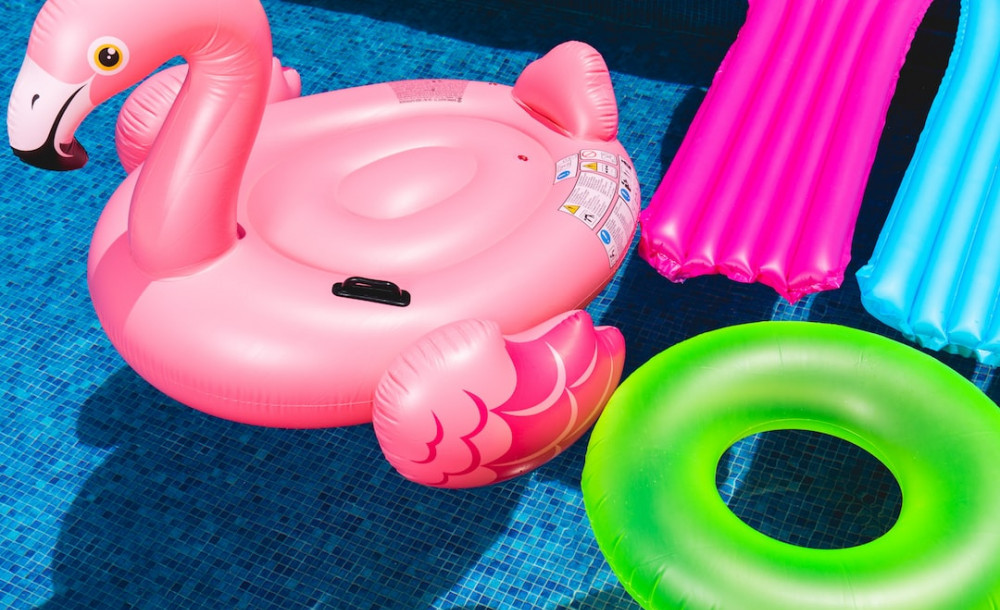 Pool floaties in a pool, flamingo floatie - hsvsheds.com